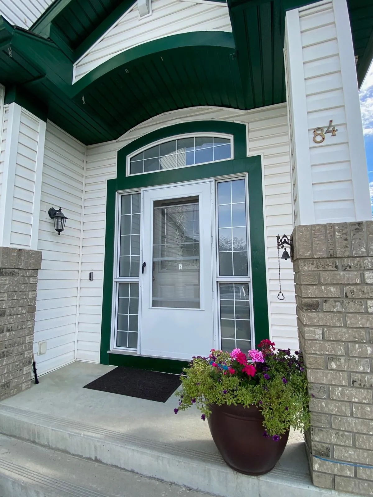 Entry door with arched transom window