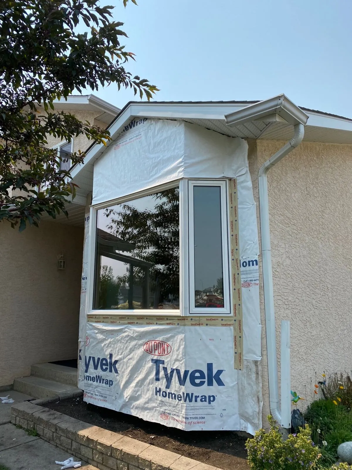 Bay window mid-install with house wrap