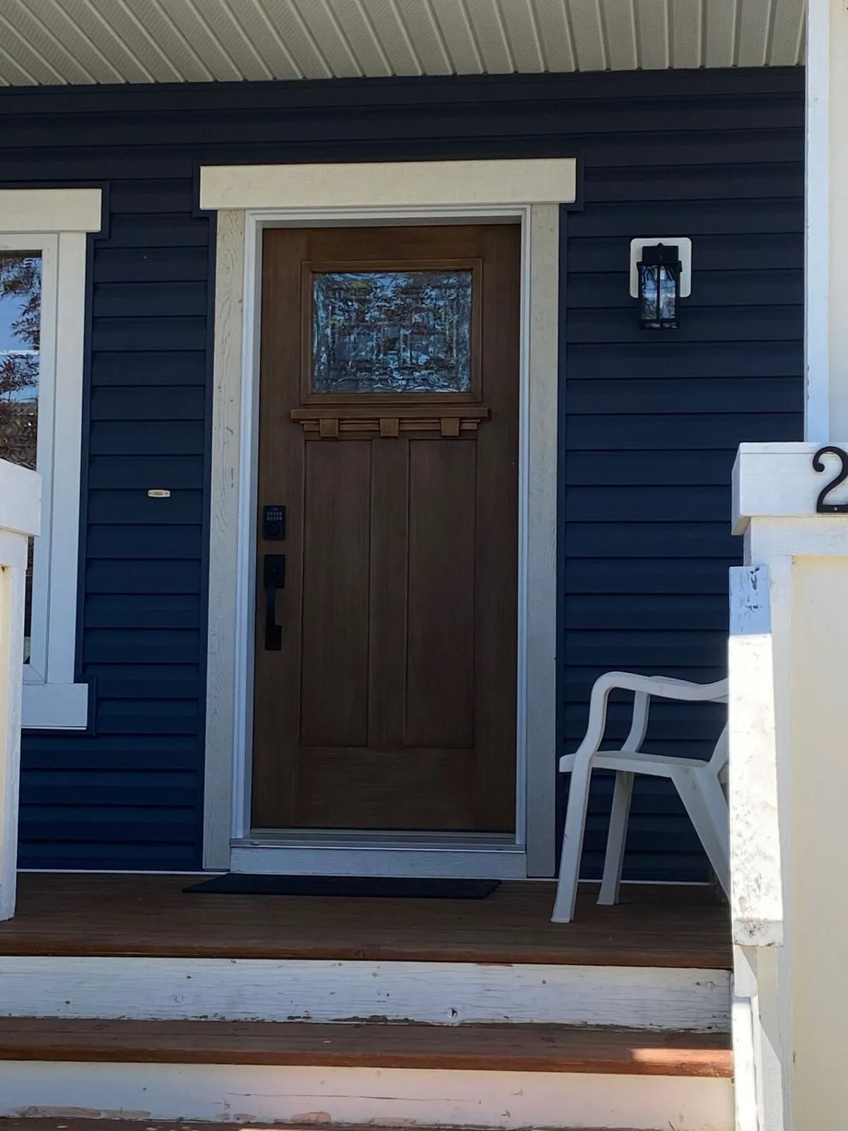 Navy craftsman entry door with black hardware