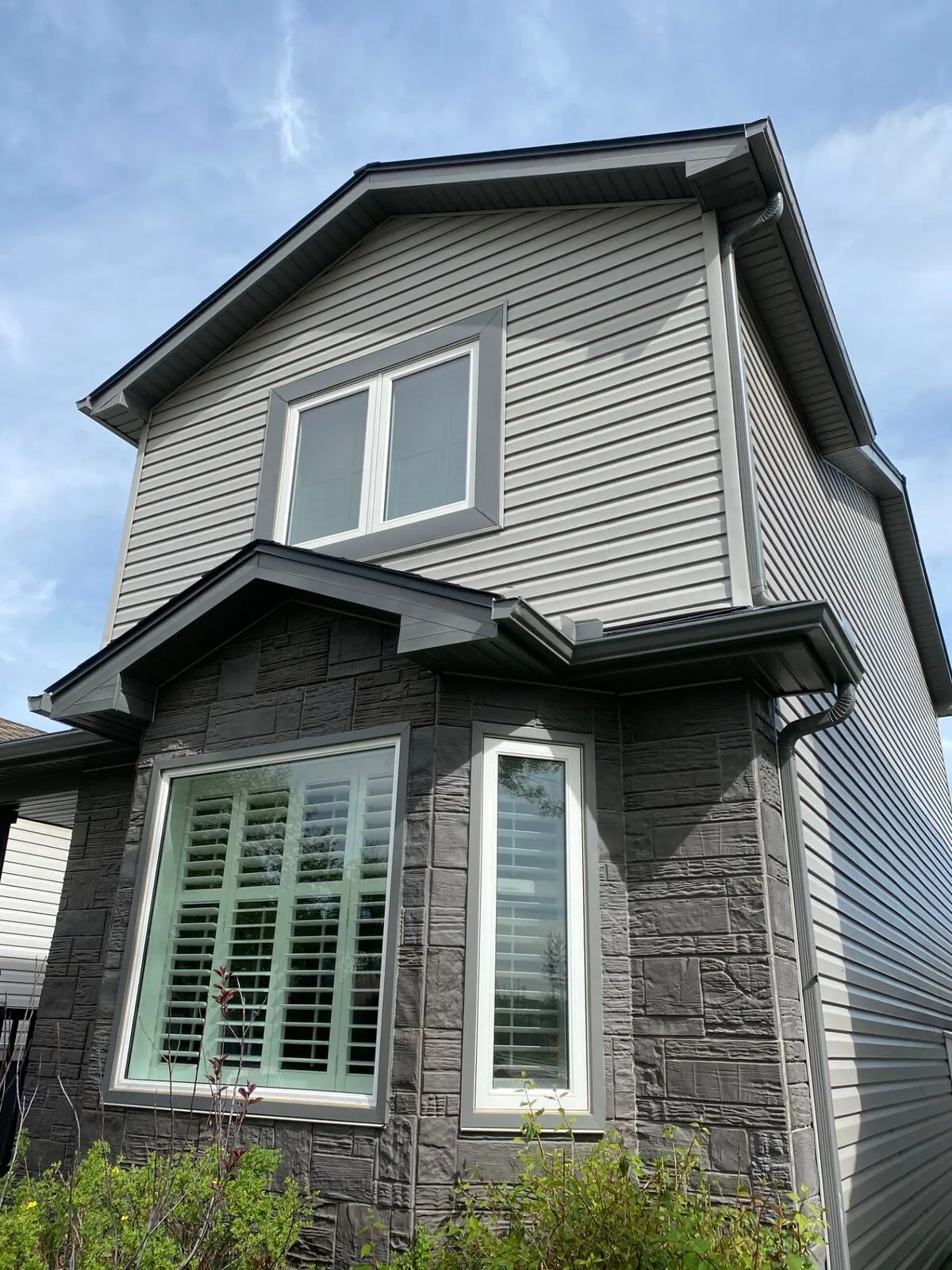Grey siding with stone wainscot