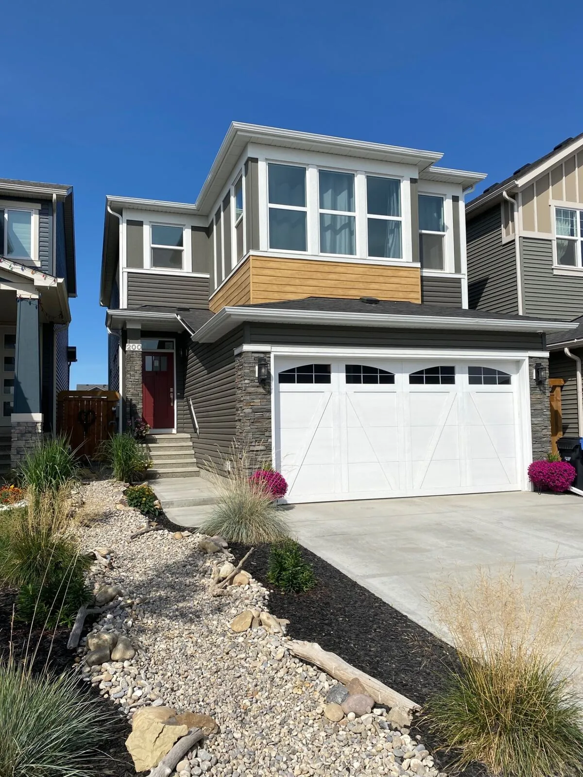 Modern two-tone siding on a two-storey home